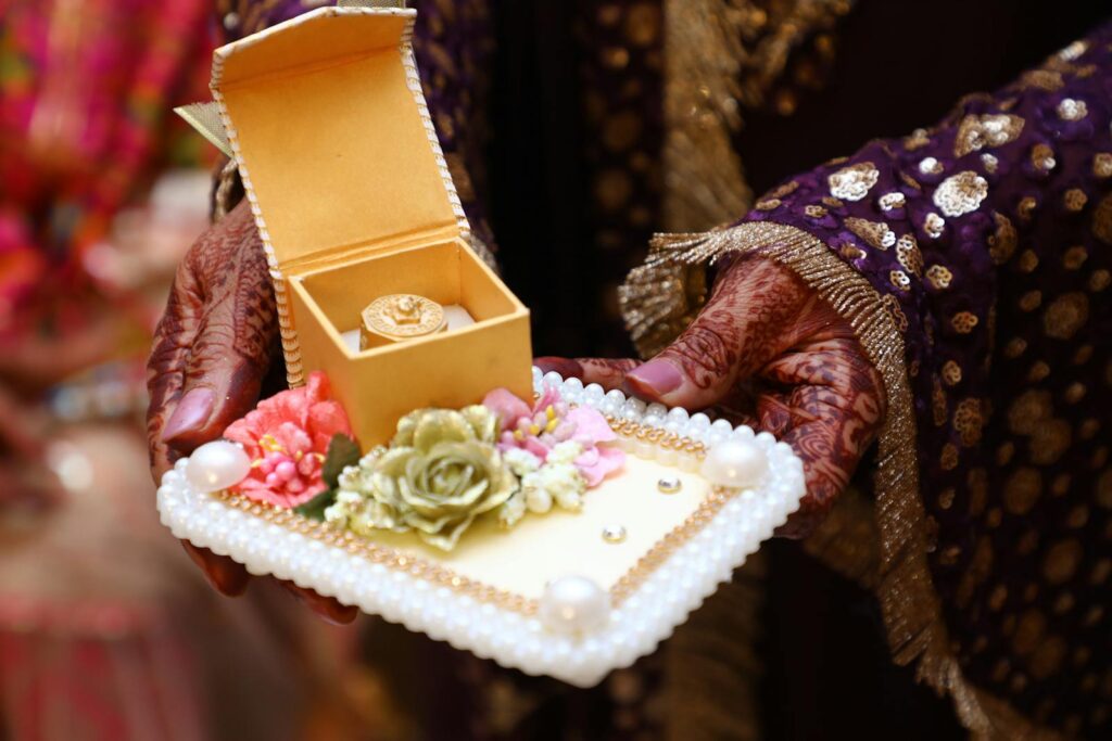 Crop ethnic woman showing traditional present