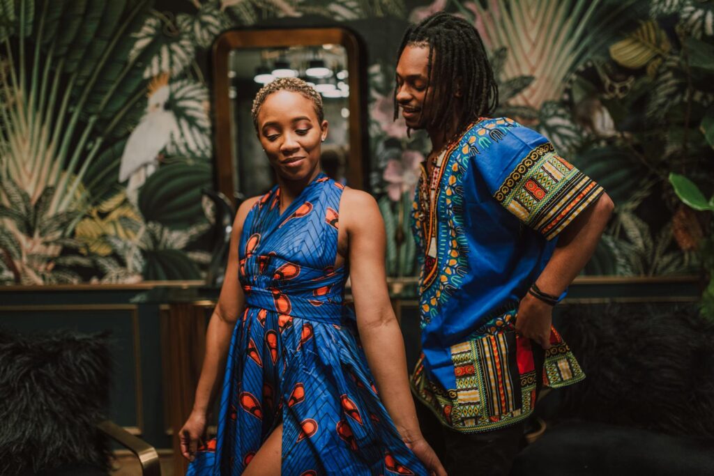 Woman in Blue Dress Dancing With A Man In Blue Shirt