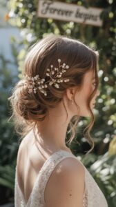 Modern bride with pearl-studded hair clip styled into soft waves, a chic hair accessory for wedding day glam.
