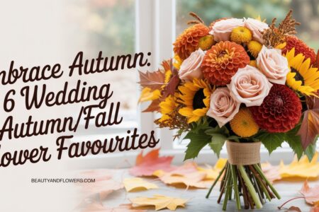 Arrangement of autumn wedding flowers featuring dahlias, roses, and sunflowers in a soft, feminine setting